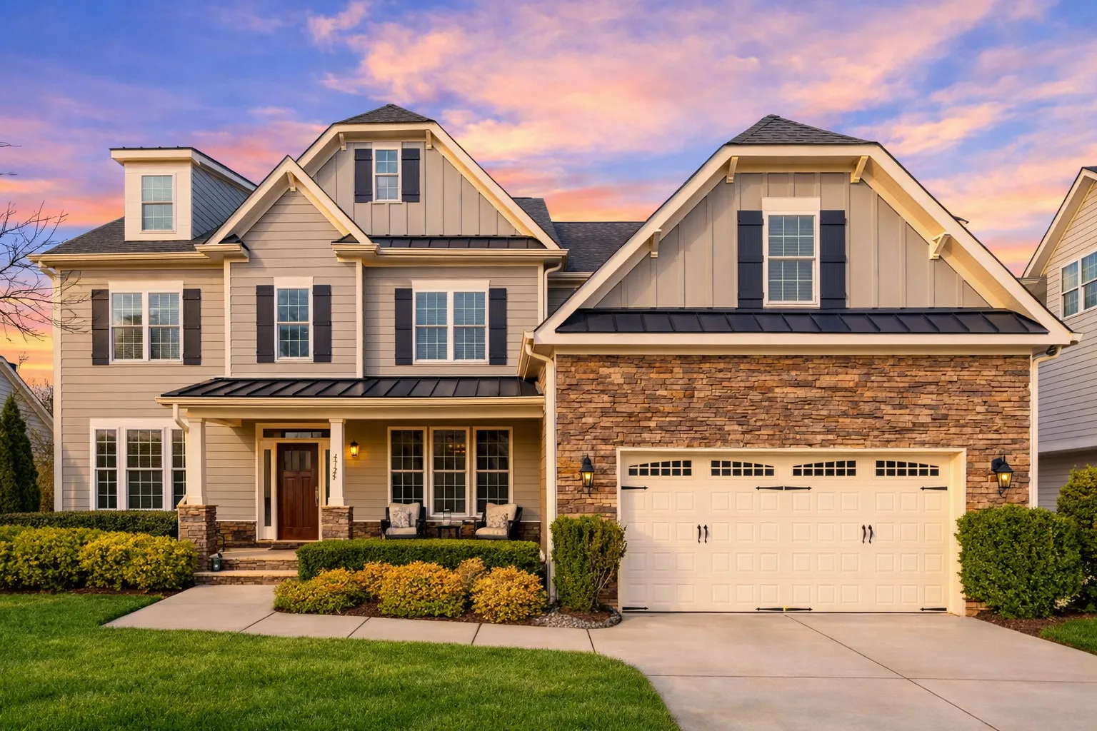 Front elevation of a New American style home with horizontal siding, stone accents, symmetrical windows, and classic suburban curb appeal