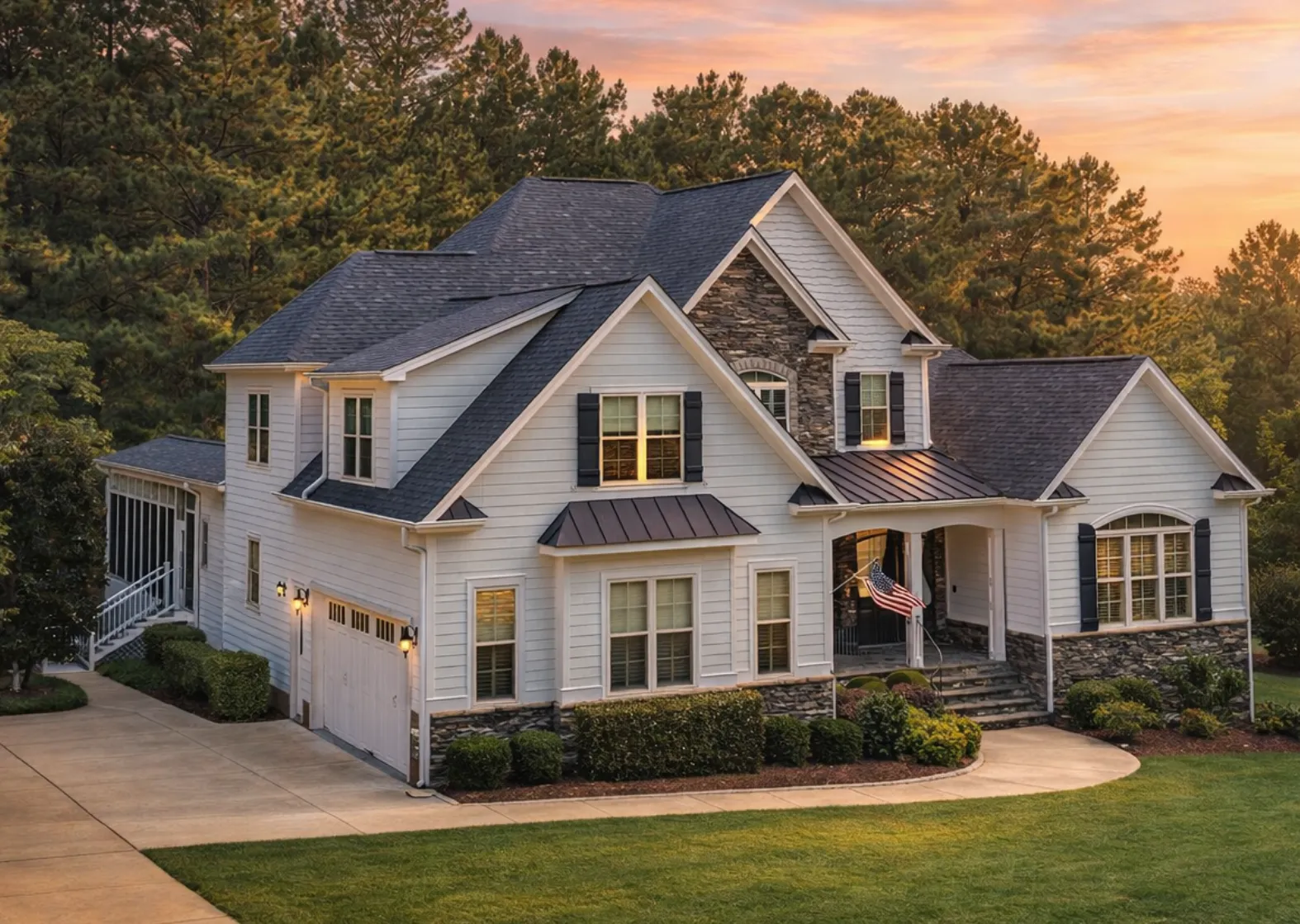 Front elevation of a New American Modern Traditional house featuring stone veneer, horizontal siding, gabled rooflines, and a covered front porch