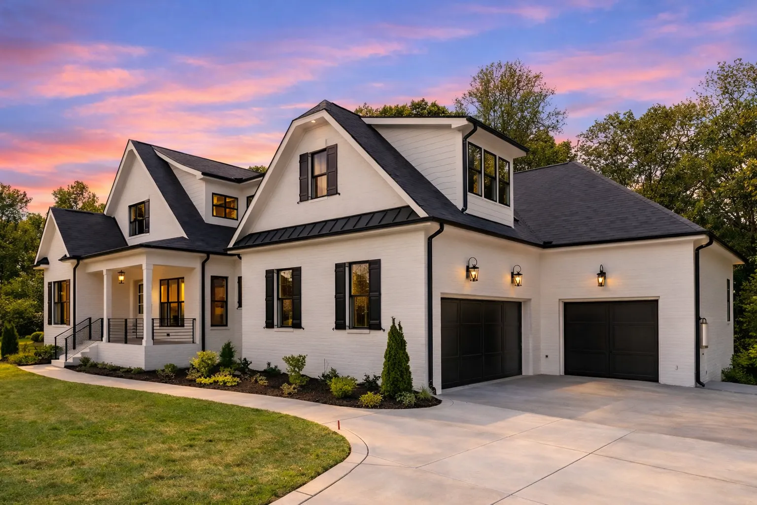 Front elevation of a Modern Farmhouse New American style home with white board and batten siding, black windows, gabled rooflines, and covered front porch