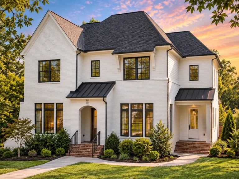House Plans with Fireplace 11 Front elevation of a Modern Farmhouse style home featuring white board and batten siding, black metal awnings, symmetrical windows, and a welcoming covered entry