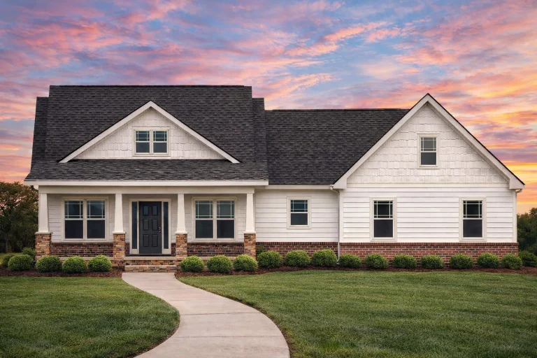 Front elevation of a New American ranch-style home featuring horizontal siding, shingle gables, brick accents, and a covered front porch