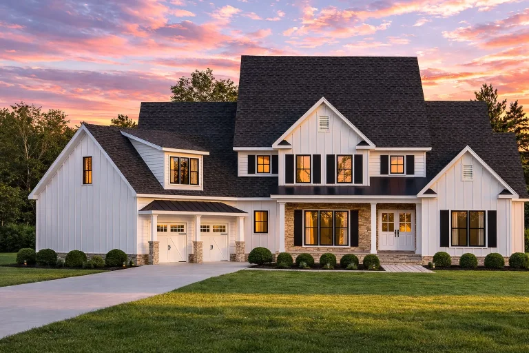 Front elevation of a modern farmhouse style home featuring board and batten siding, stone accents, wood garage doors, and a covered porch