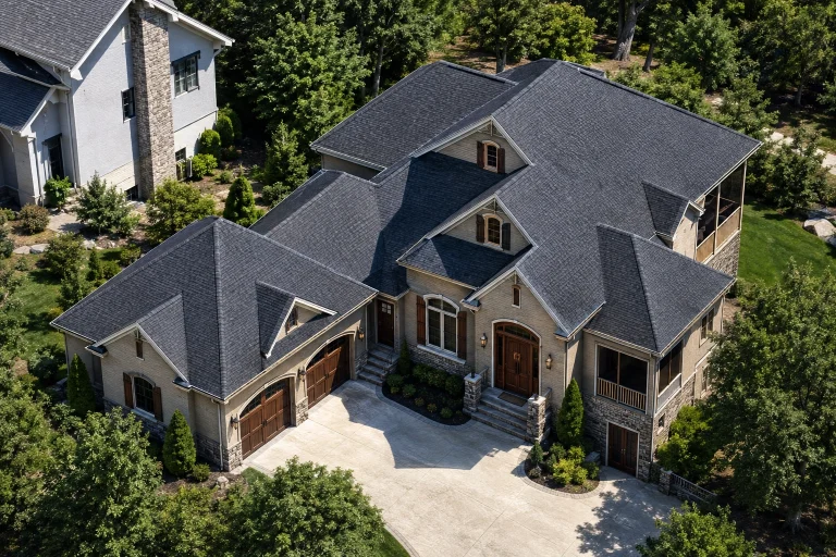 Front elevation of New American Traditional style home with stone accents, horizontal siding, dormer windows, and landscaped entry
