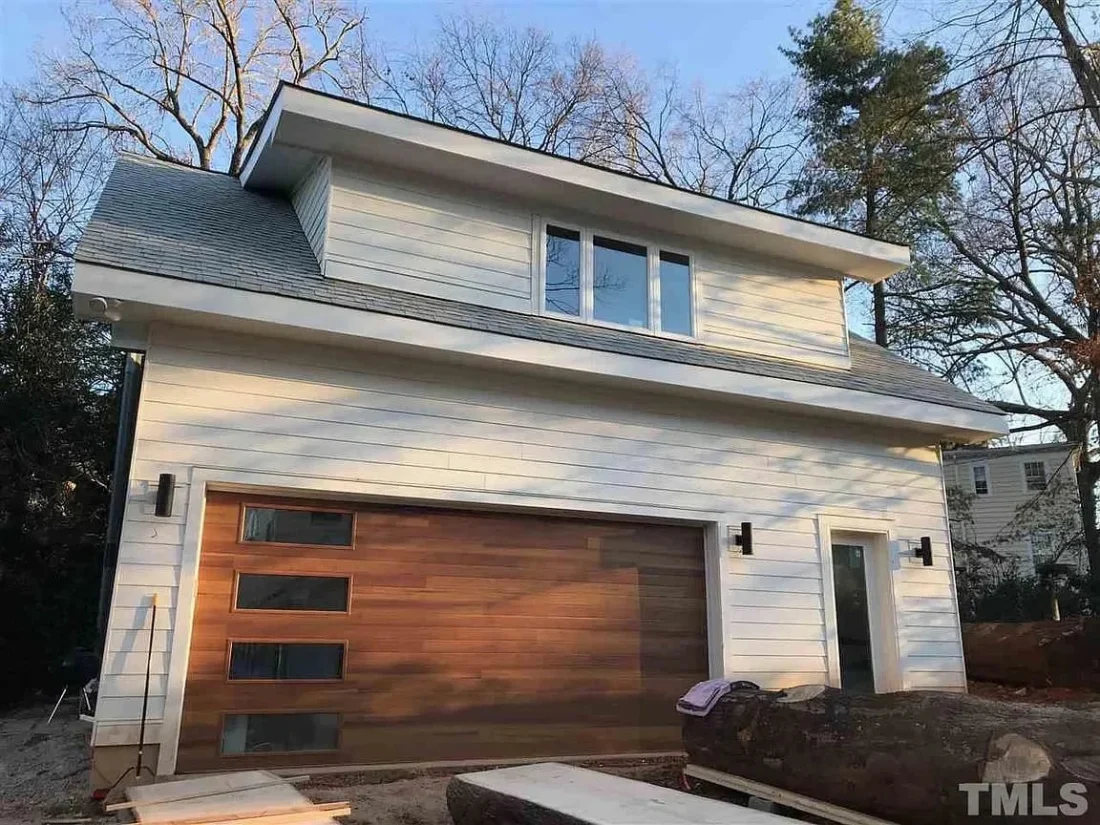 Modern Garage Home Plan with Heated Gym & Workshop