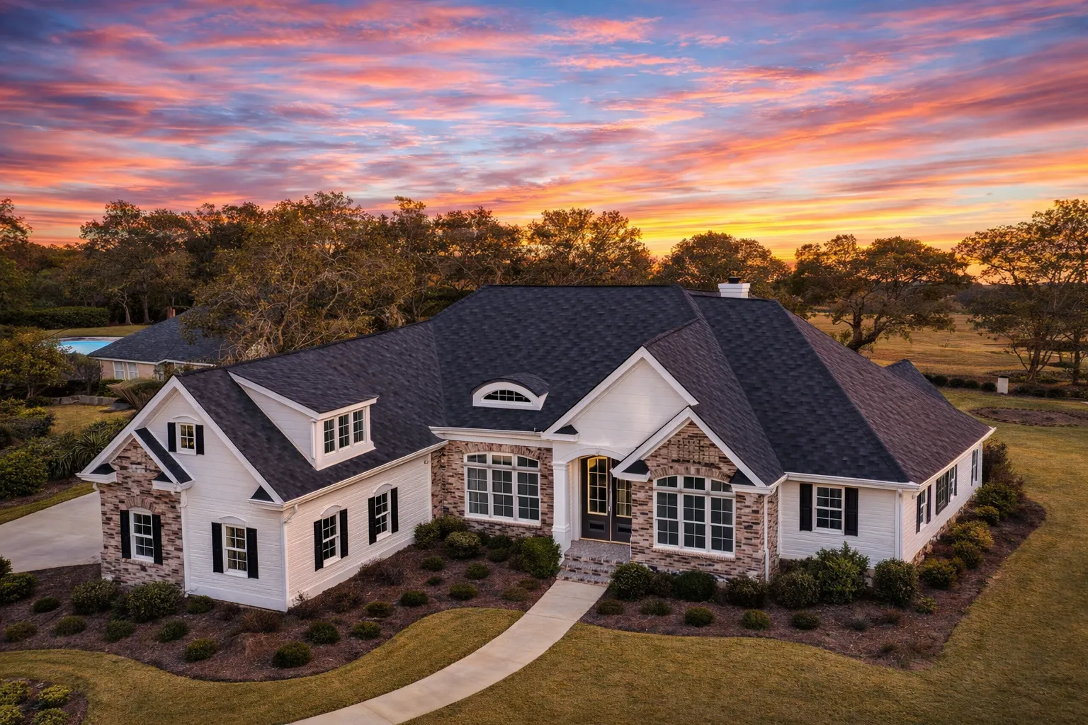 Front elevation of a New American traditional house with brick exterior, symmetrical windows, steep gabled roof, and classic Colonial Revival detailing