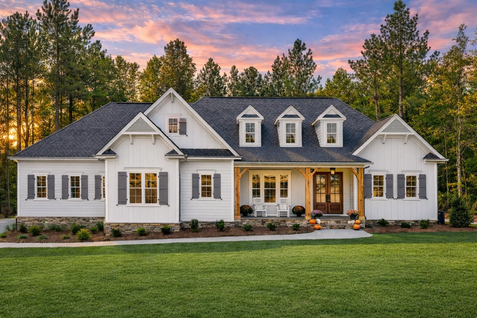 Front exterior of a New American Modern Traditional house featuring Craftsman influences, gabled rooflines, horizontal siding, board and batten accents, and a welcoming covered porch