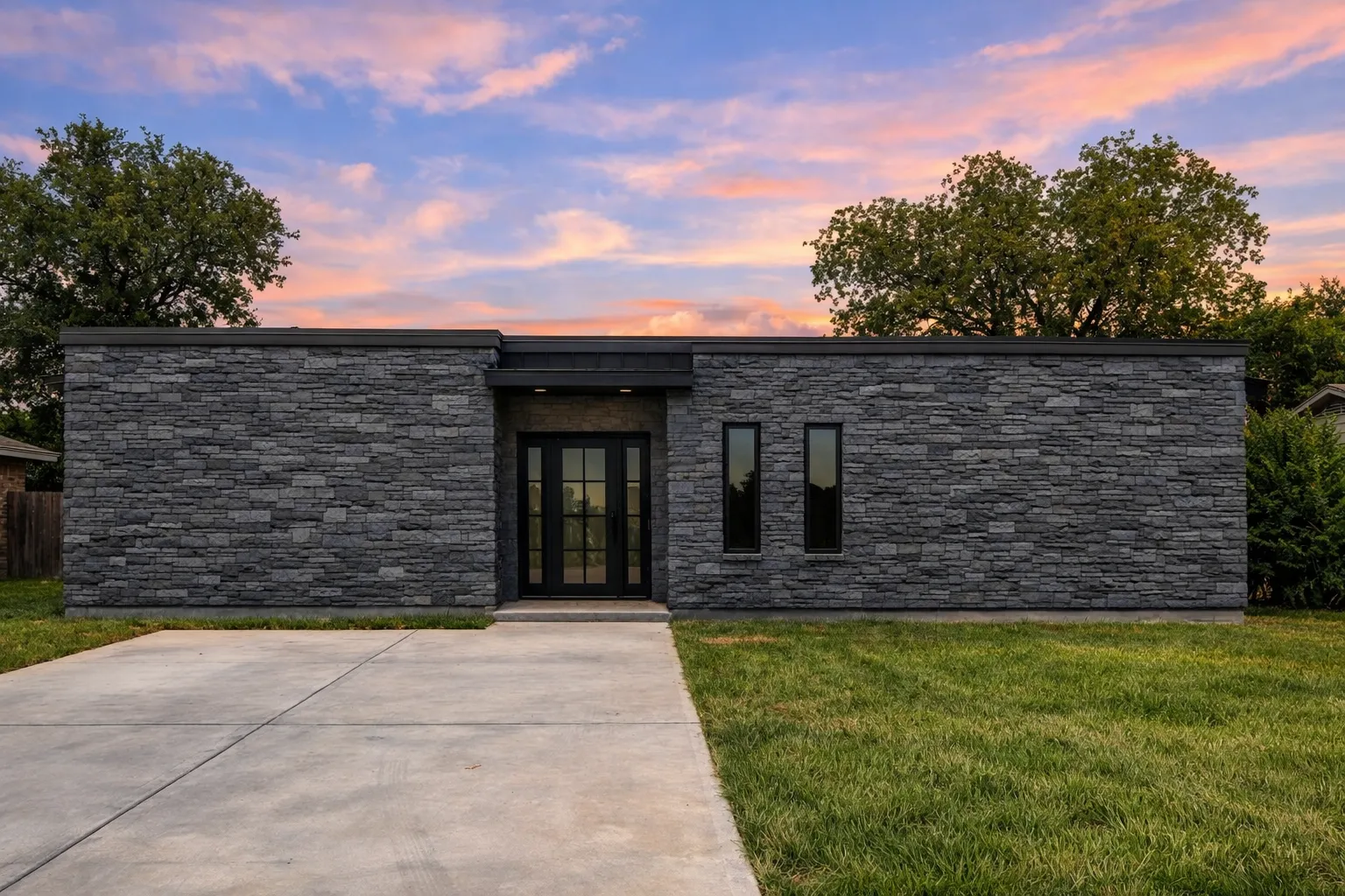 Front elevation of a Modern Contemporary style home featuring smooth stucco exterior, flat rooflines, and minimalist balcony design