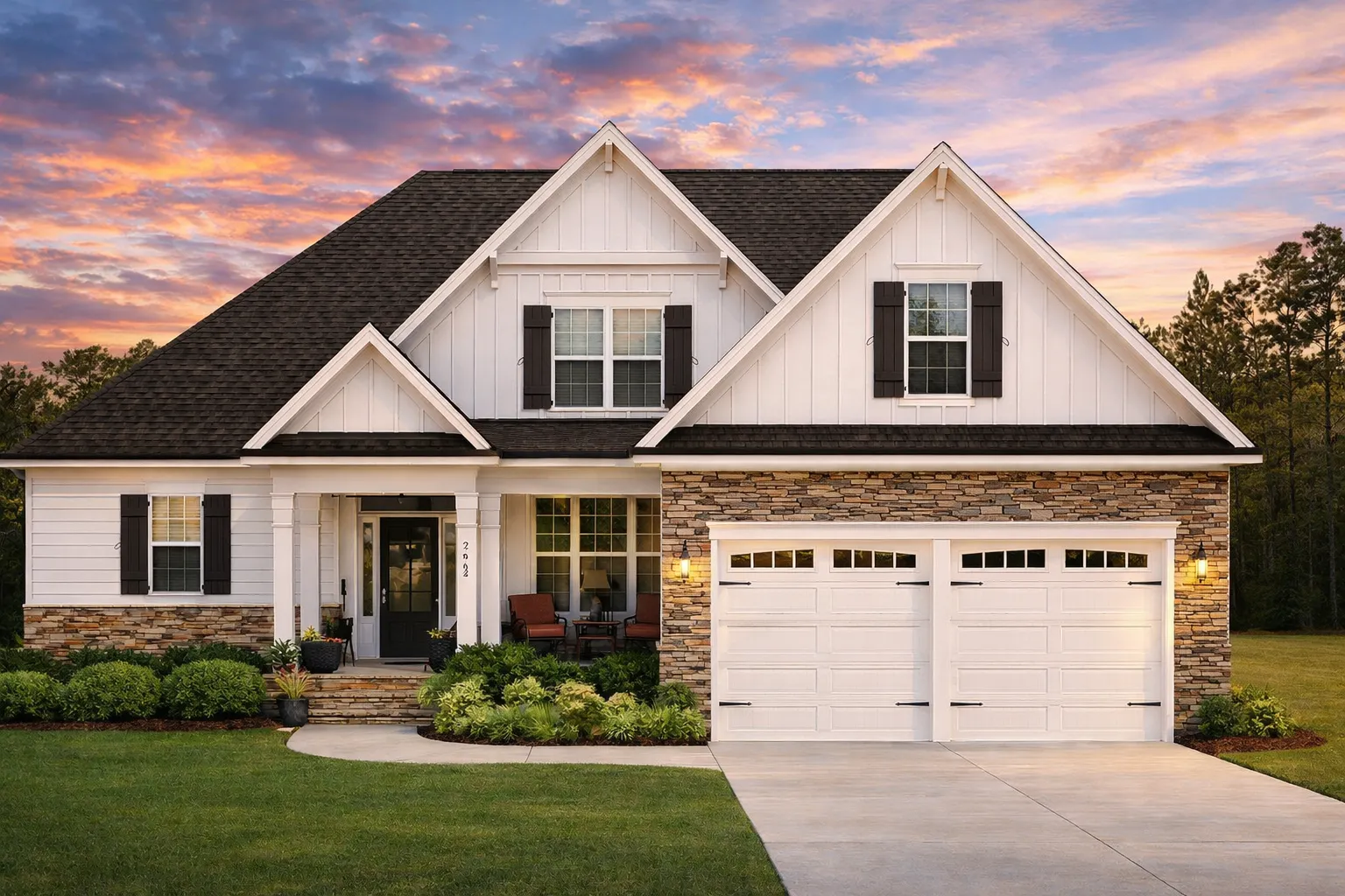 Front elevation of a New American modern traditional house with horizontal siding, board and batten gables, covered porch, and double garage