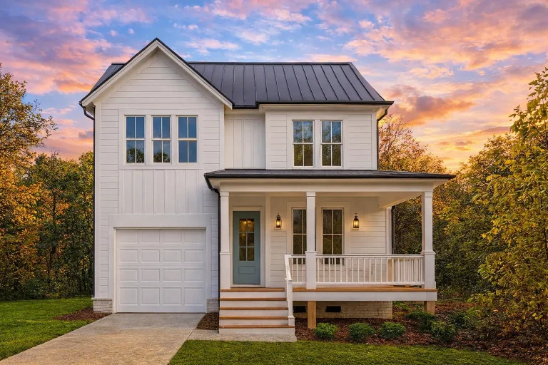 Front exterior view of a Modern Farmhouse style home with board and batten siding, standing seam metal roof, covered porch, and front-entry garage