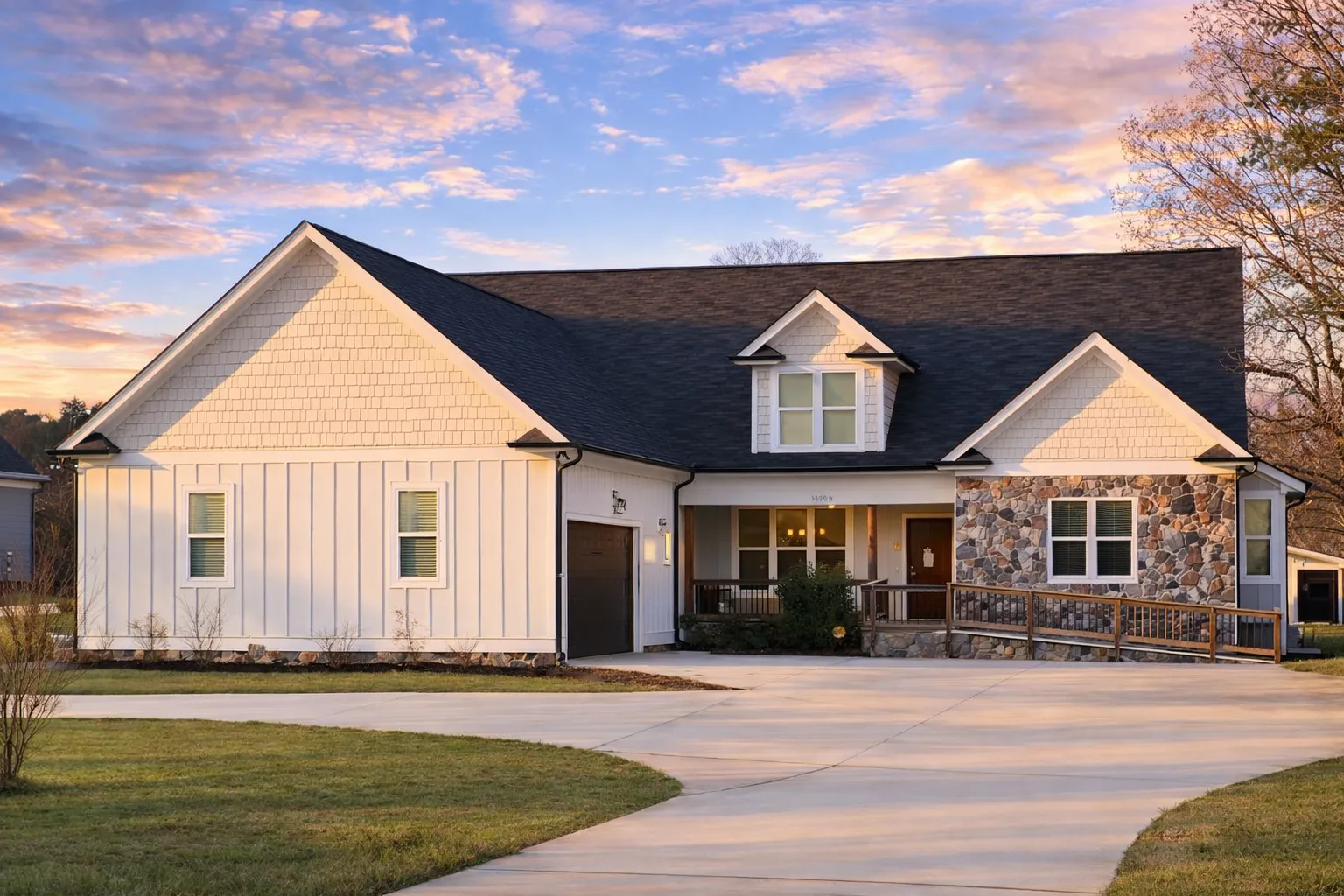 Front elevation of a Cape Cod style home with horizontal siding, brick foundation, symmetrical windows, and central entry