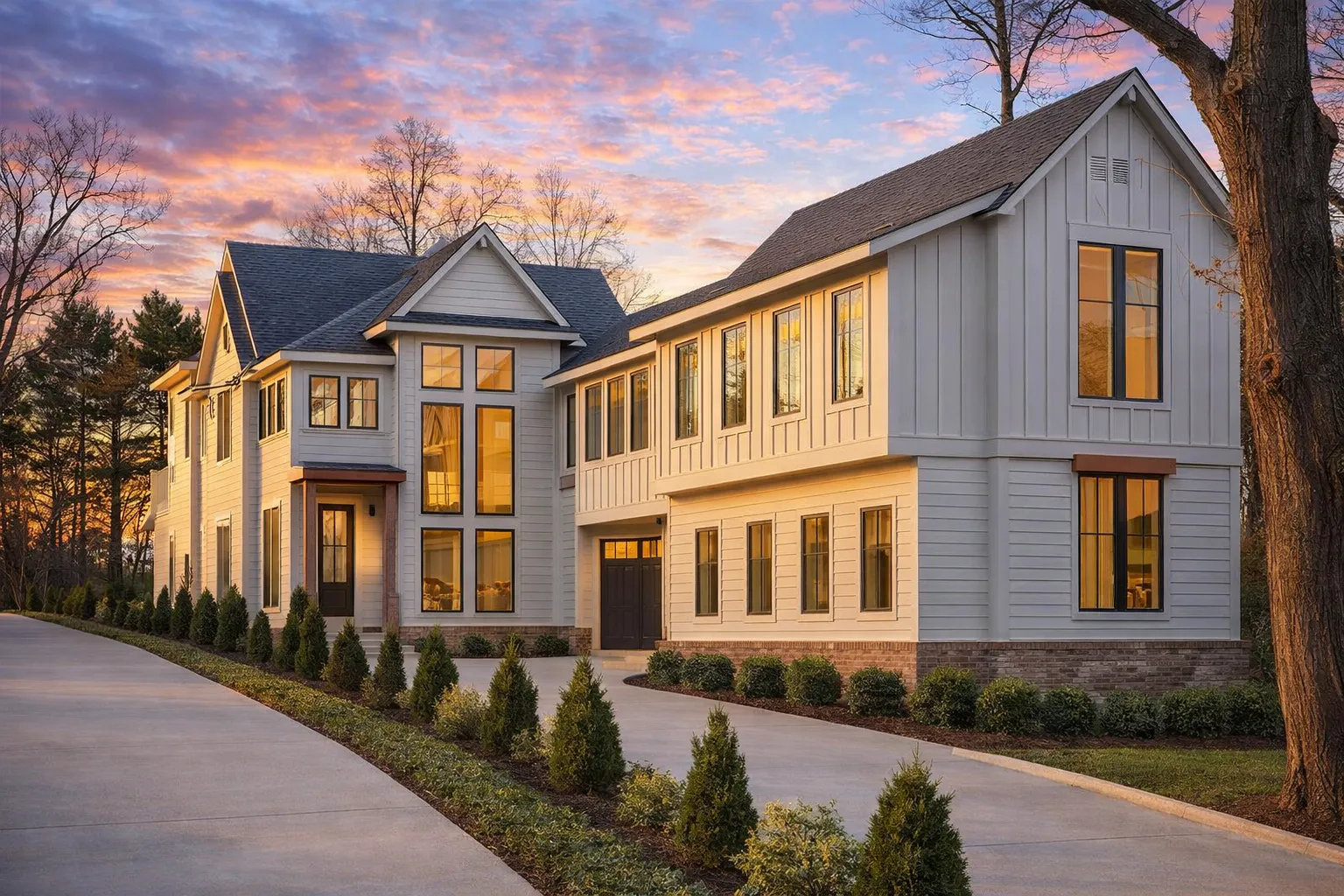 Front exterior of a New American Modern Traditional house featuring brick masonry, board-and-batten siding, tall windows, and a refined suburban design