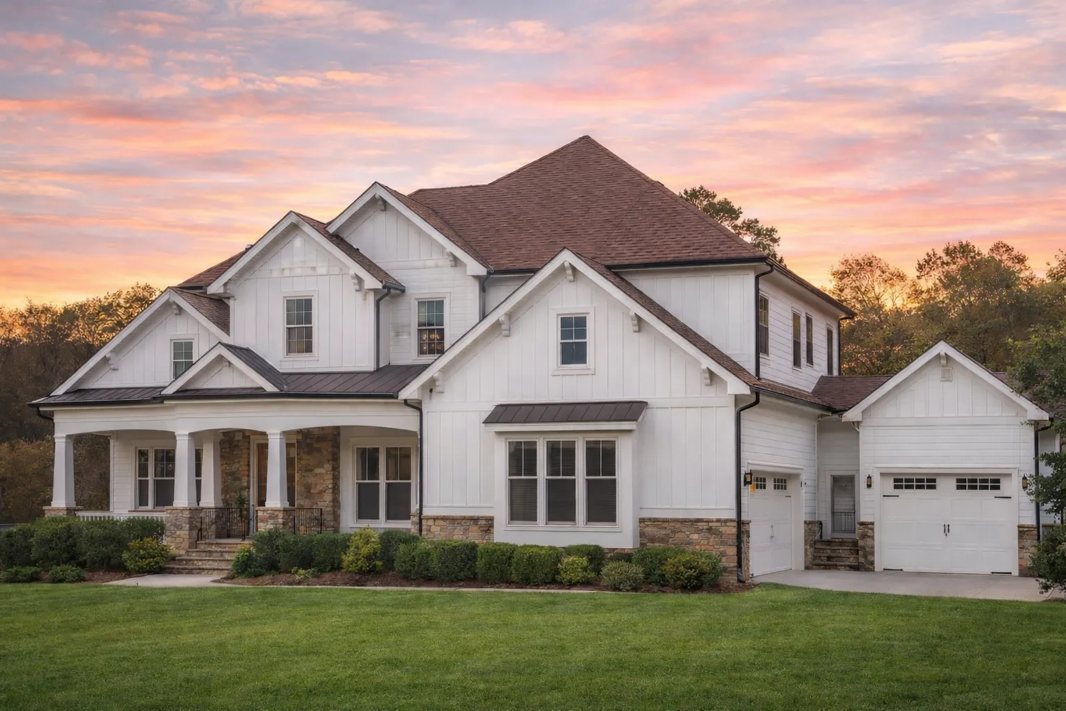 Front elevation of a New American modern traditional house with stone accents, horizontal siding, gabled rooflines, and side-entry garage