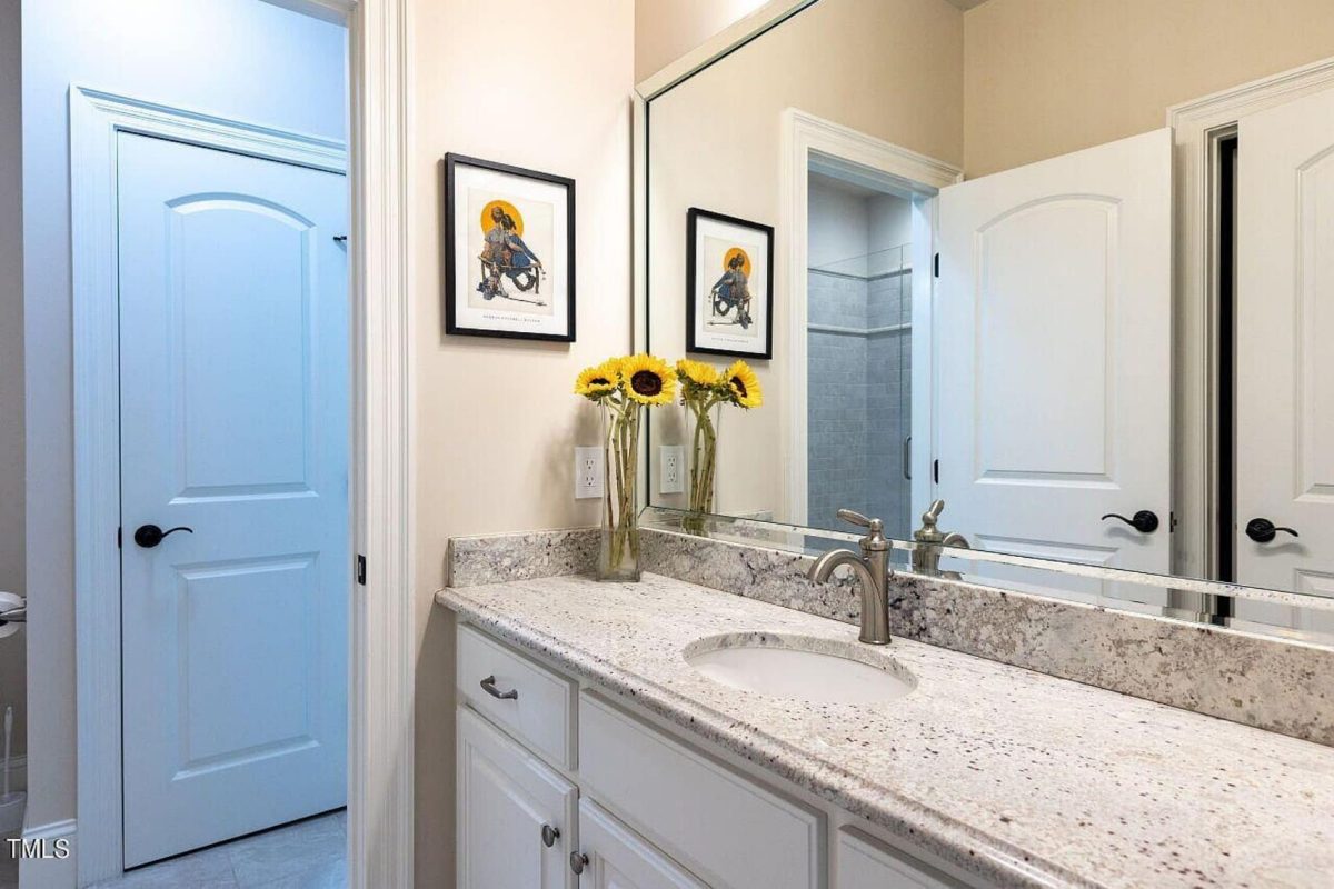 Traditional 4-Bedroom House Plan with Front-Entry Garage