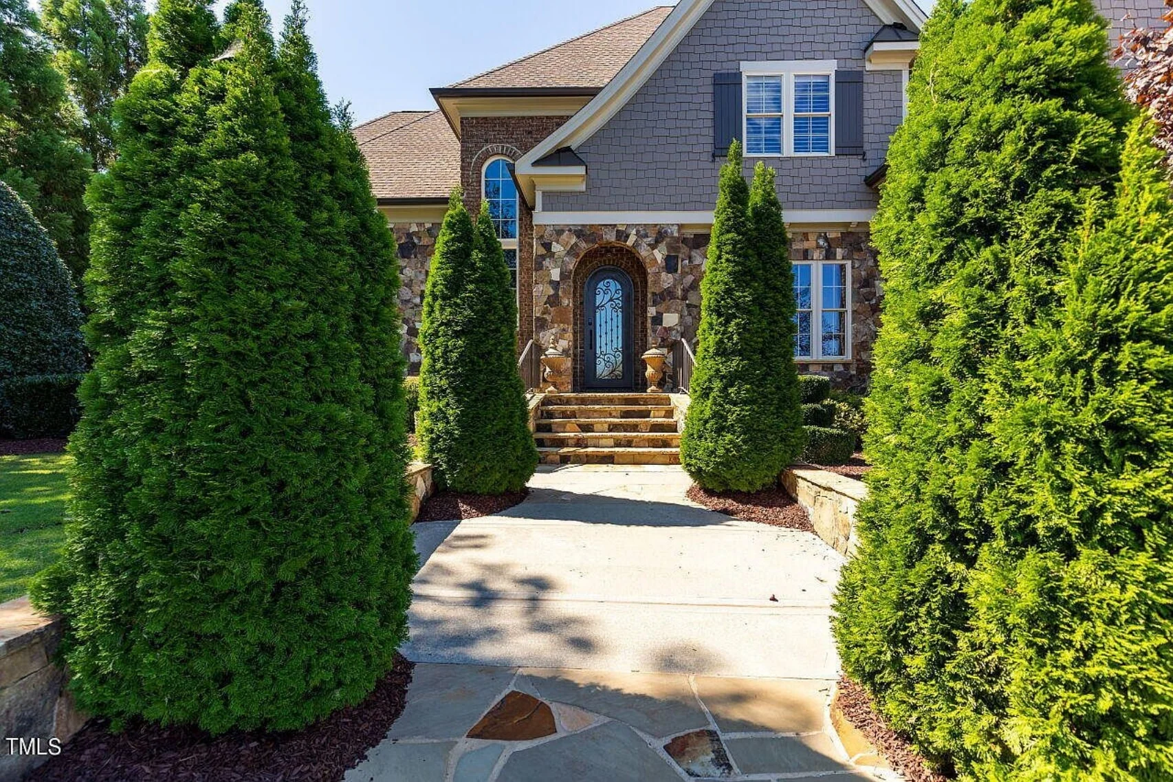 Traditional 4-Bedroom House Plan with Front-Entry Garage