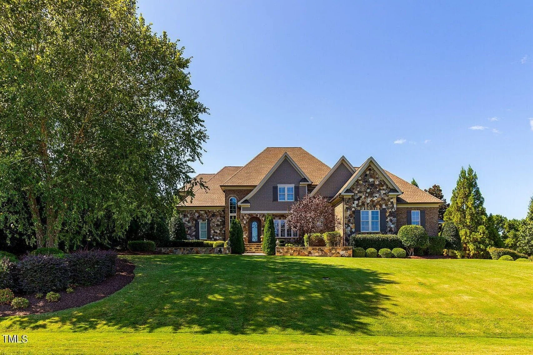 Traditional 4-Bedroom House Plan with Front-Entry Garage