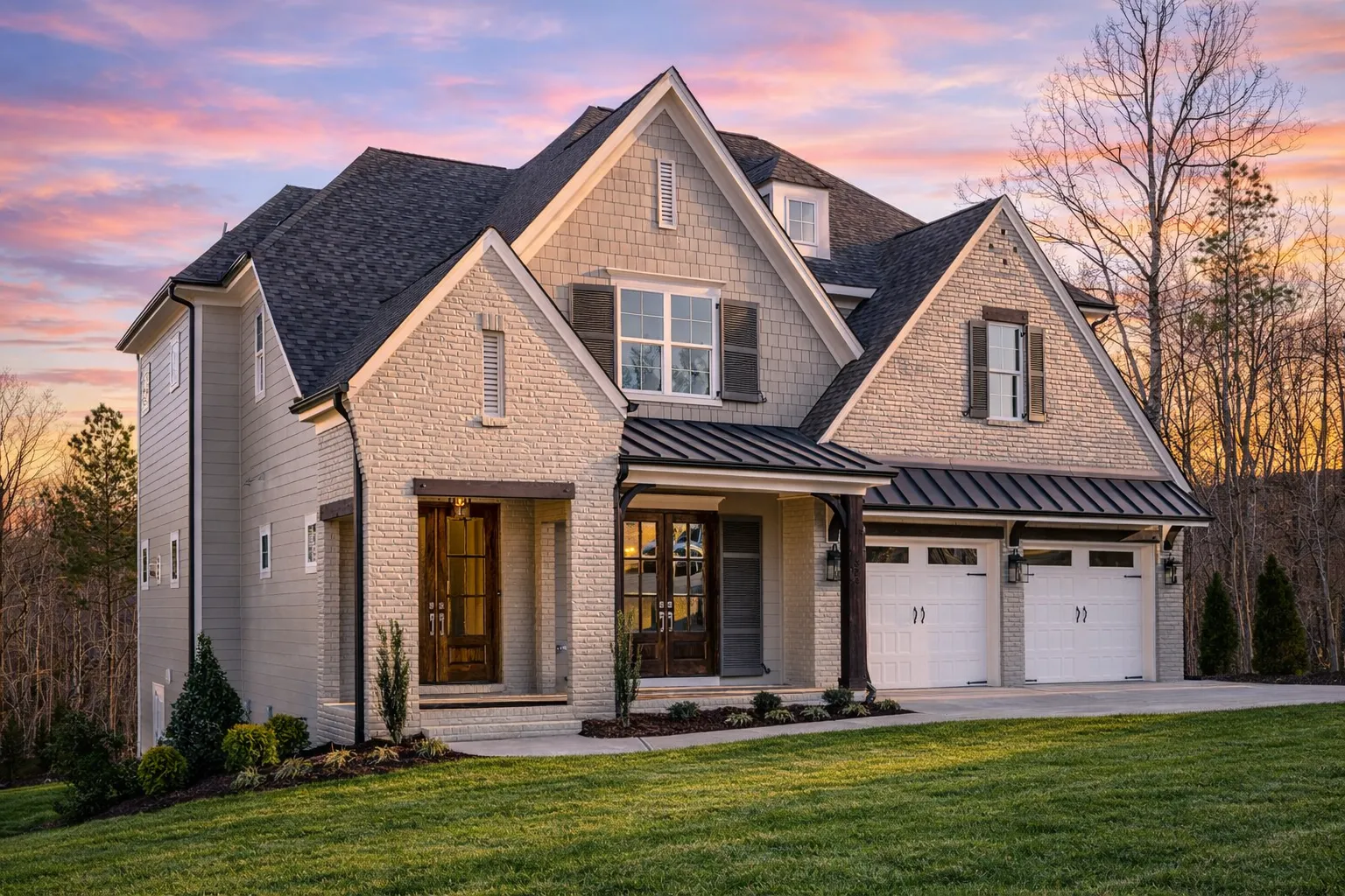 Front elevation of a Traditional New American style home featuring brick exterior, symmetrical gables, shuttered windows, and a two-car garage