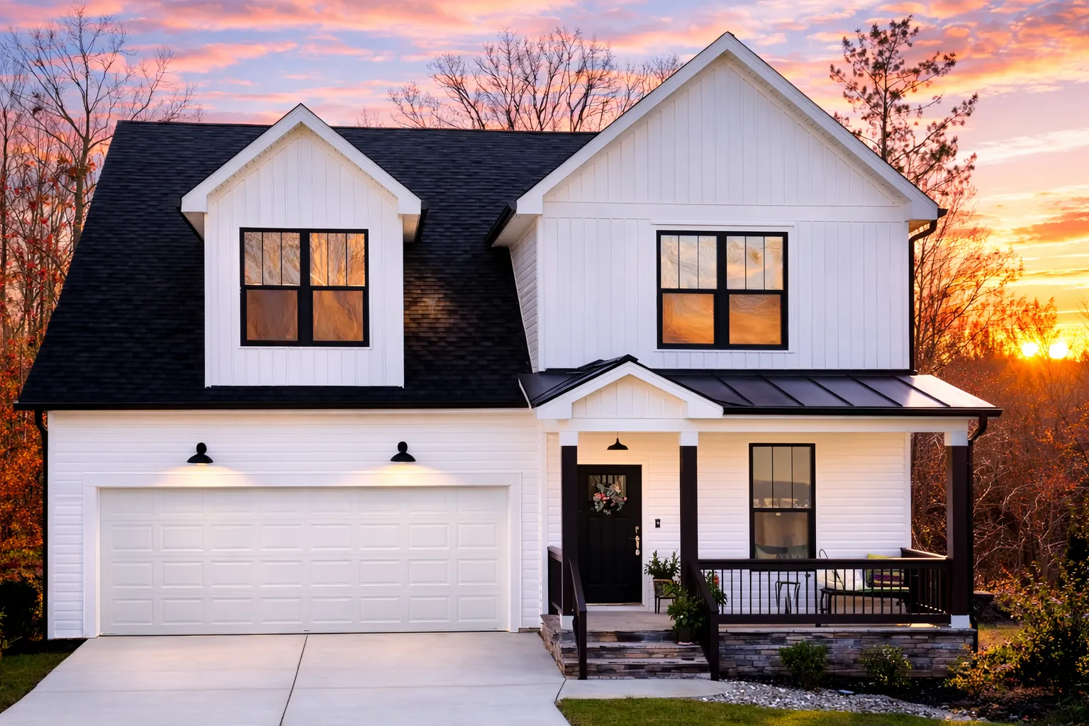 Front view of a Traditional Ranch Cottage home featuring horizontal siding, brick foundation, and a welcoming covered porch with classic columns