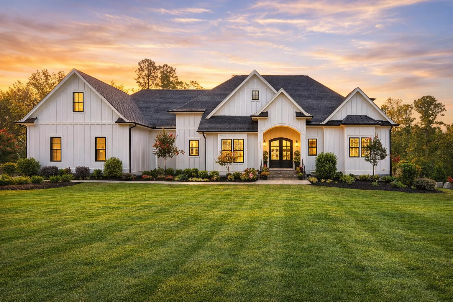 House Plans with Rear Entry Garage 15 Front exterior view of a modern farmhouse style home featuring white board and batten siding, gabled rooflines, and a welcoming covered entry