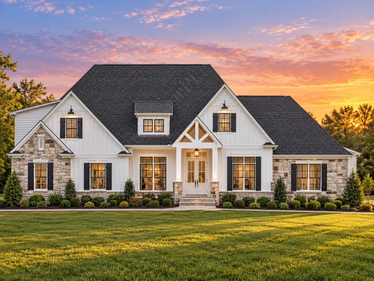 Contemporary House Plans 6 Front elevation of a Modern Farmhouse style home featuring board and batten siding, stone accents, steep gable rooflines, and a welcoming covered entry