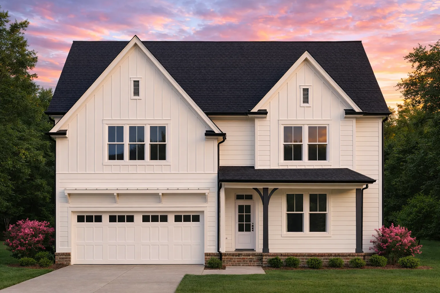 Front elevation of a Modern Farmhouse style home featuring board and batten siding, gabled rooflines, and an attached two-car garage