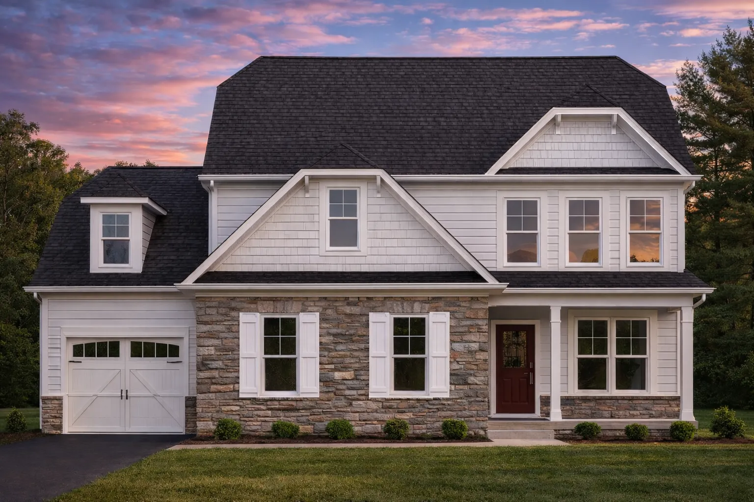 Front elevation of a Traditional Colonial style house featuring stone and horizontal siding, wood shutters, and symmetrical windows for classic curb appeal
