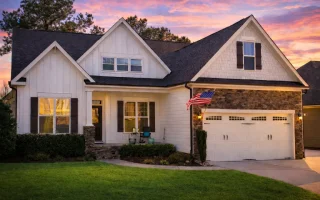 Craftsman cottage style house plan with gabled roof, front porch, and two-car garage