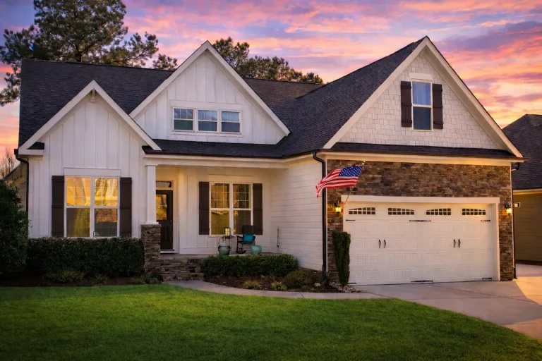 Craftsman cottage style house plan with gabled roof, front porch, and two-car garage