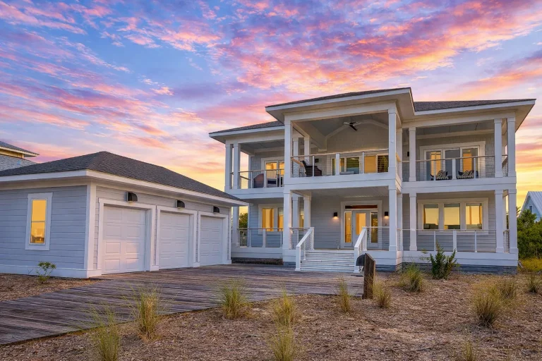 Front elevation of a Low Country coastal style home with painted siding, double front porches, and Southern architectural symmetry