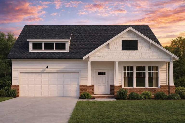 Front view of a Traditional Ranch style home featuring gray horizontal lap siding, stone accents, and a two-car garage under a symmetrical gable roofline