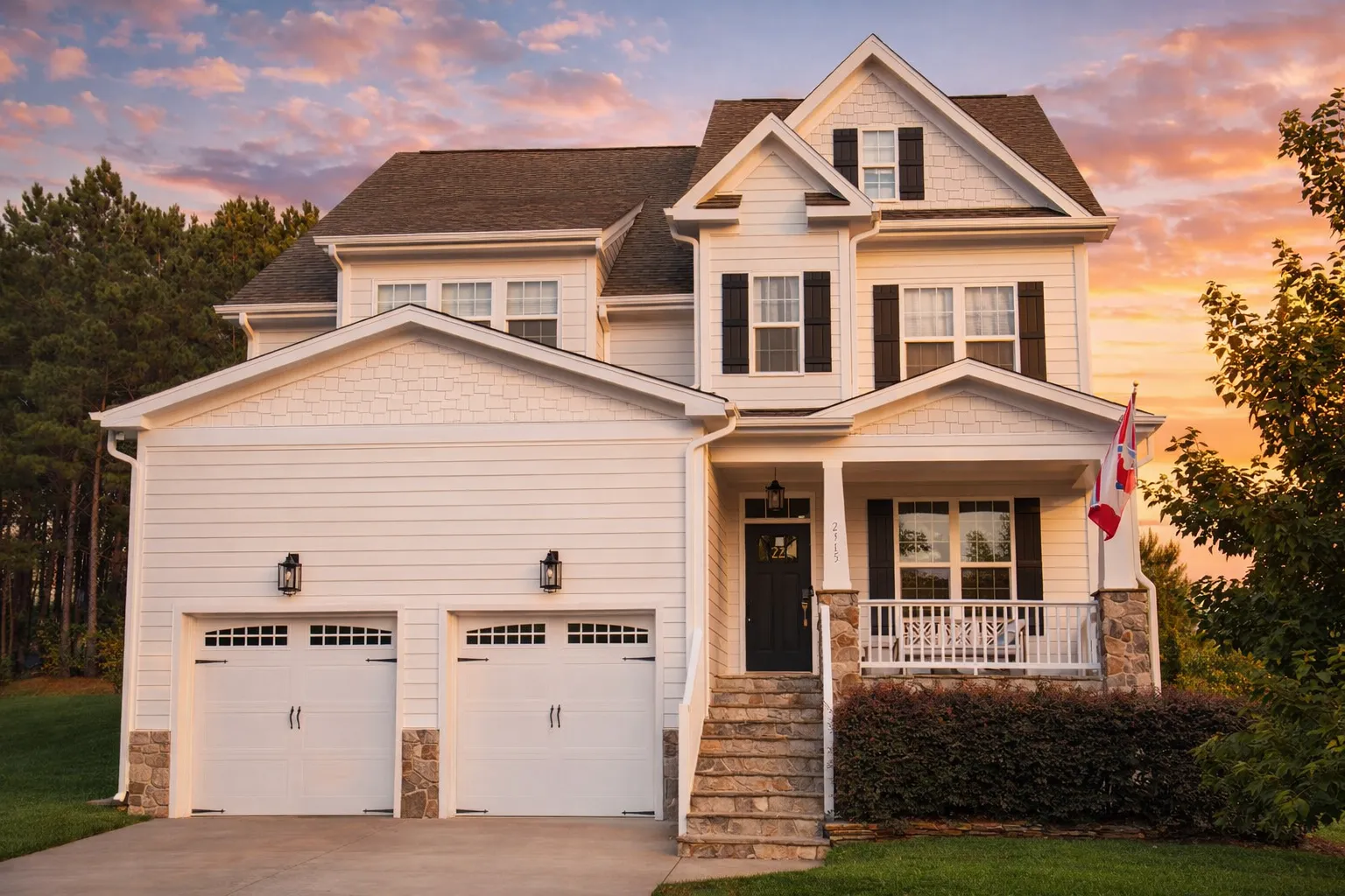 Front view of Modern Farmhouse Craftsman style house with board and batten siding, stone accents, and covered porch entry