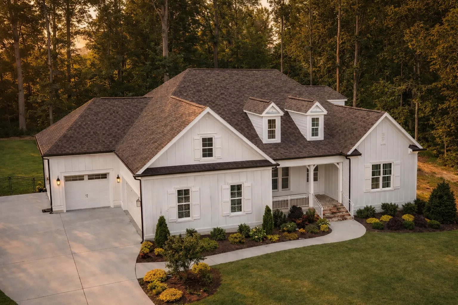 Front exterior view of a Traditional New American style home with symmetrical facade, gabled rooflines, lap siding, shutters, and covered entry porch