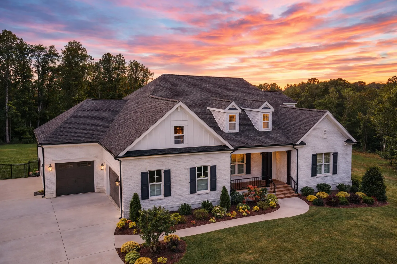 Front exterior view of a Traditional New American style home with symmetrical facade, gabled rooflines, lap siding, shutters, and covered entry porch