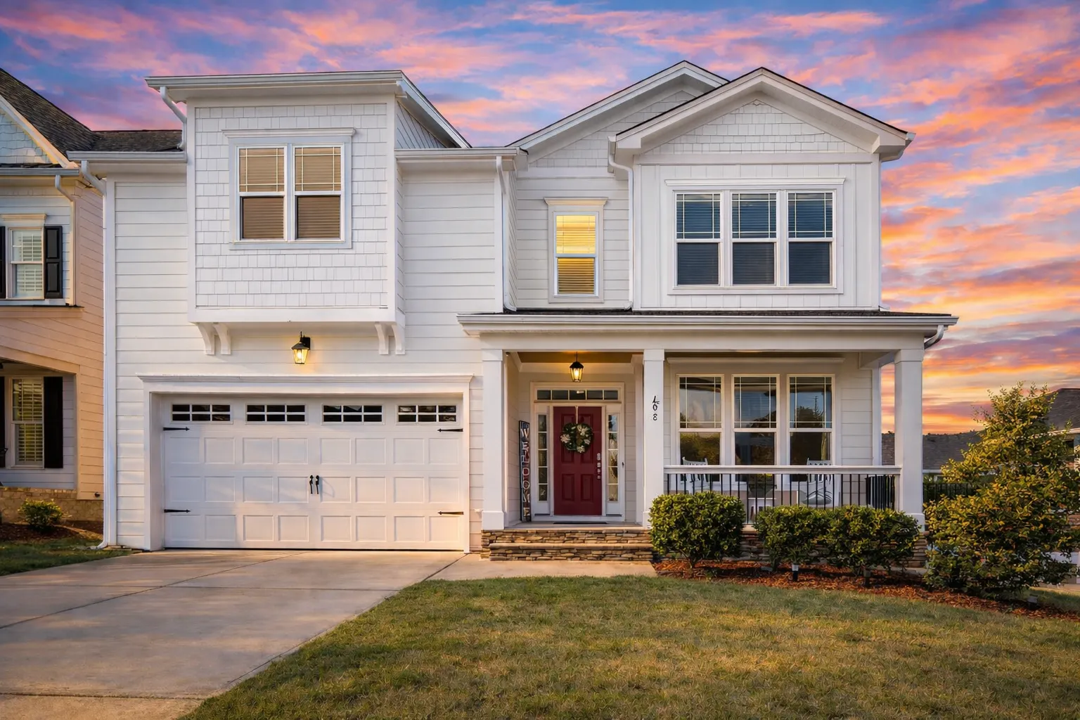 Garage Apartment Plans 19 Front elevation of traditional suburban house with white horizontal siding, gabled rooflines, red front door, and covered porch