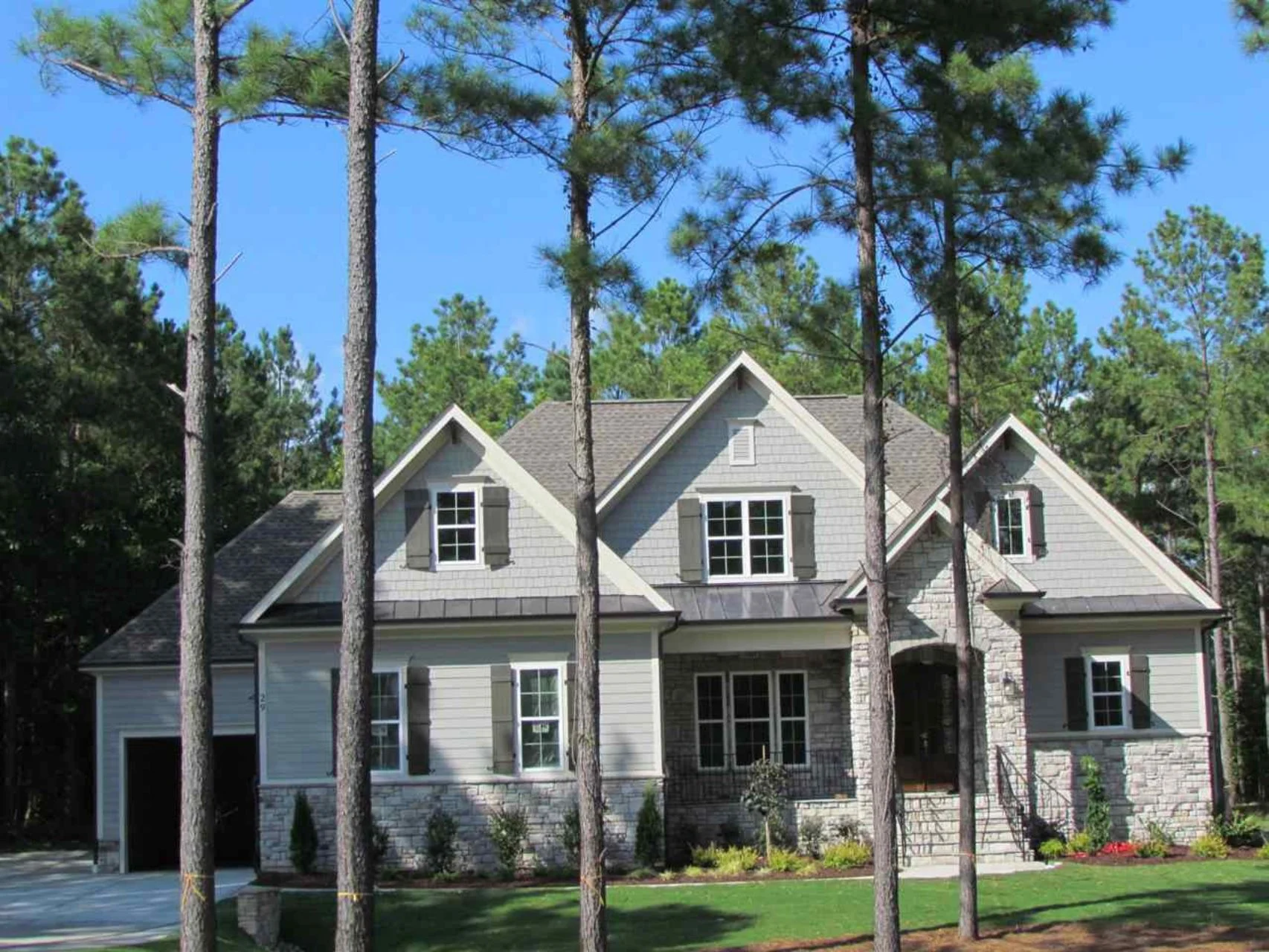 Craftsman house Floor Plan with Spacious Garage and Open Layout