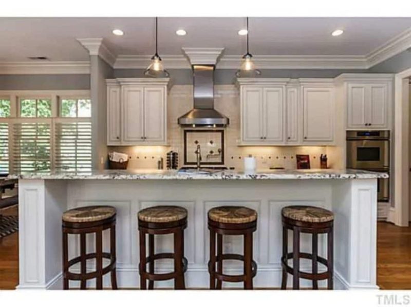 Traditional Craftsman house Plan with 4 Beds, 3 Garage Bays, and Vaulted Ceilings