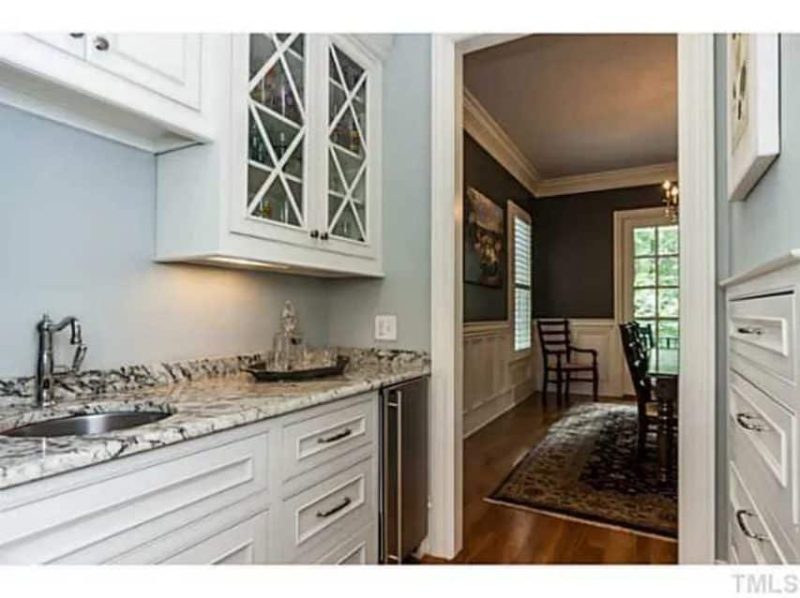 Traditional Craftsman house Plan with 4 Beds, 3 Garage Bays, and Vaulted Ceilings