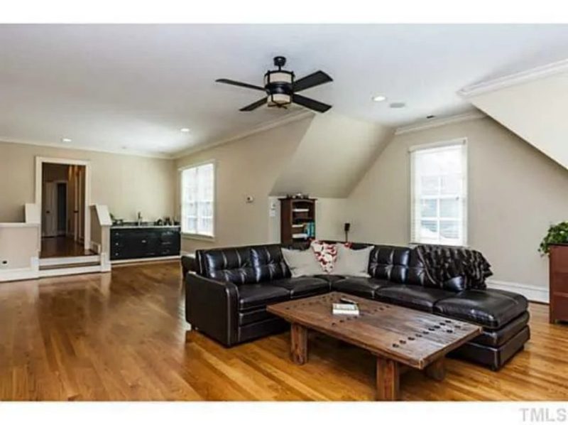 Traditional Craftsman house Plan with 4 Beds, 3 Garage Bays, and Vaulted Ceilings