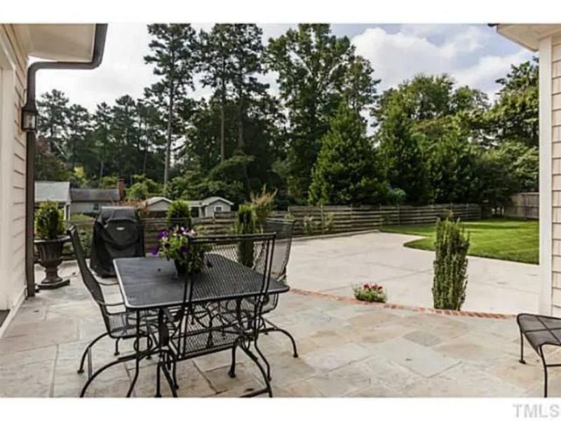 Traditional Craftsman house Plan with 4 Beds, 3 Garage Bays, and Vaulted Ceilings