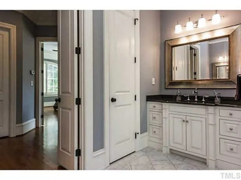 Traditional Craftsman house Plan with 4 Beds, 3 Garage Bays, and Vaulted Ceilings