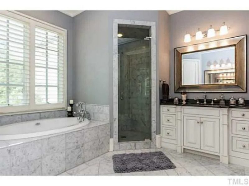 Traditional Craftsman house Plan with 4 Beds, 3 Garage Bays, and Vaulted Ceilings