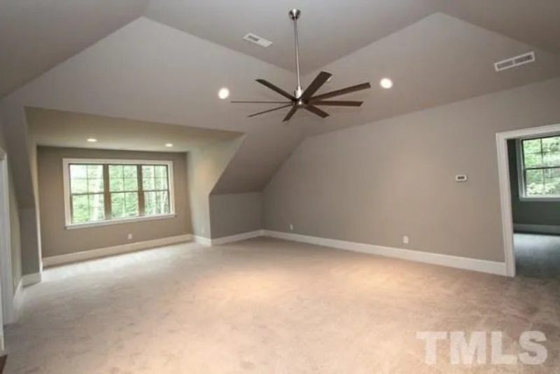 Traditional Craftsman house Plan with 4 Bedrooms and 3-Car Garage