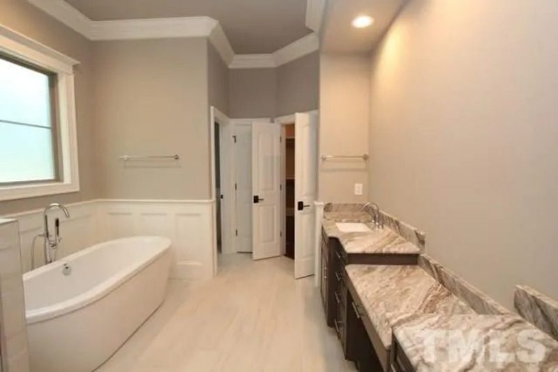 Traditional Craftsman house Plan with 4 Bedrooms and 3-Car Garage