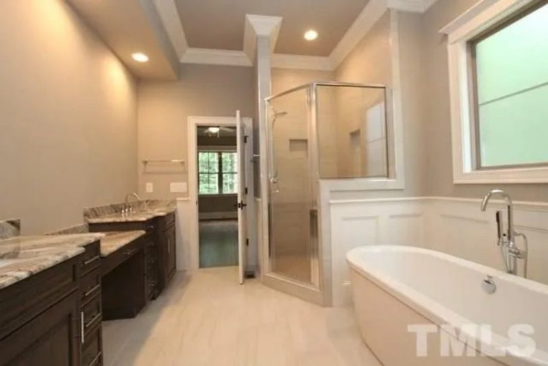 Traditional Craftsman house Plan with 4 Bedrooms and 3-Car Garage