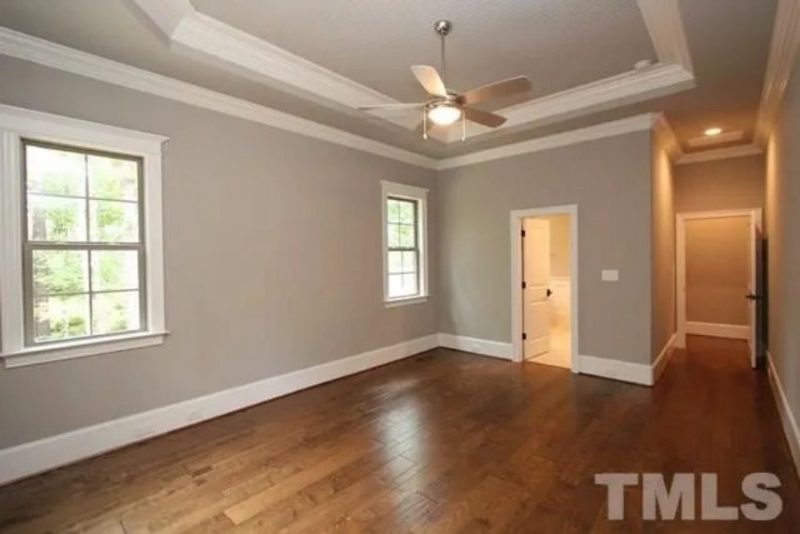 Traditional Craftsman house Plan with 4 Bedrooms and 3-Car Garage