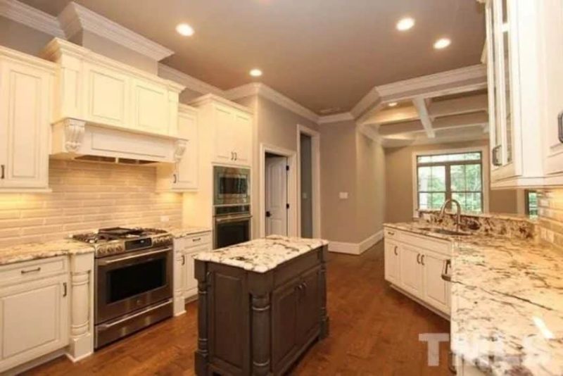 Traditional Craftsman house Plan with 4 Bedrooms and 3-Car Garage