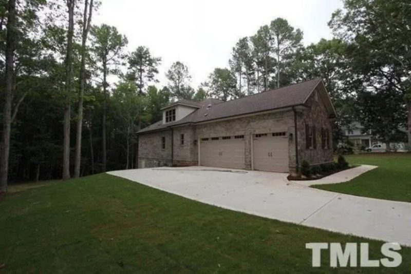 Traditional Craftsman house Plan with 4 Bedrooms and 3-Car Garage