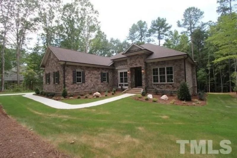 Traditional Craftsman house Plan with 4 Bedrooms and 3-Car Garage