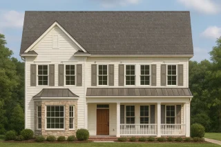 Front view of a Traditional Colonial style home featuring horizontal siding, stone base, symmetrical windows, and a covered front porch with white columns