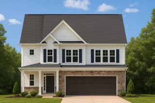 Front view of a Traditional Colonial style two-story home featuring stone veneer, horizontal lap siding, board-and-batten gable, and a welcoming covered entry porch.
