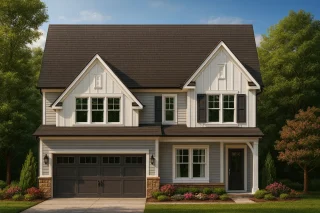 Front view of a Modern Farmhouse style two-story home featuring board and batten siding, brick accents, gable roofs, and a welcoming front porch entry